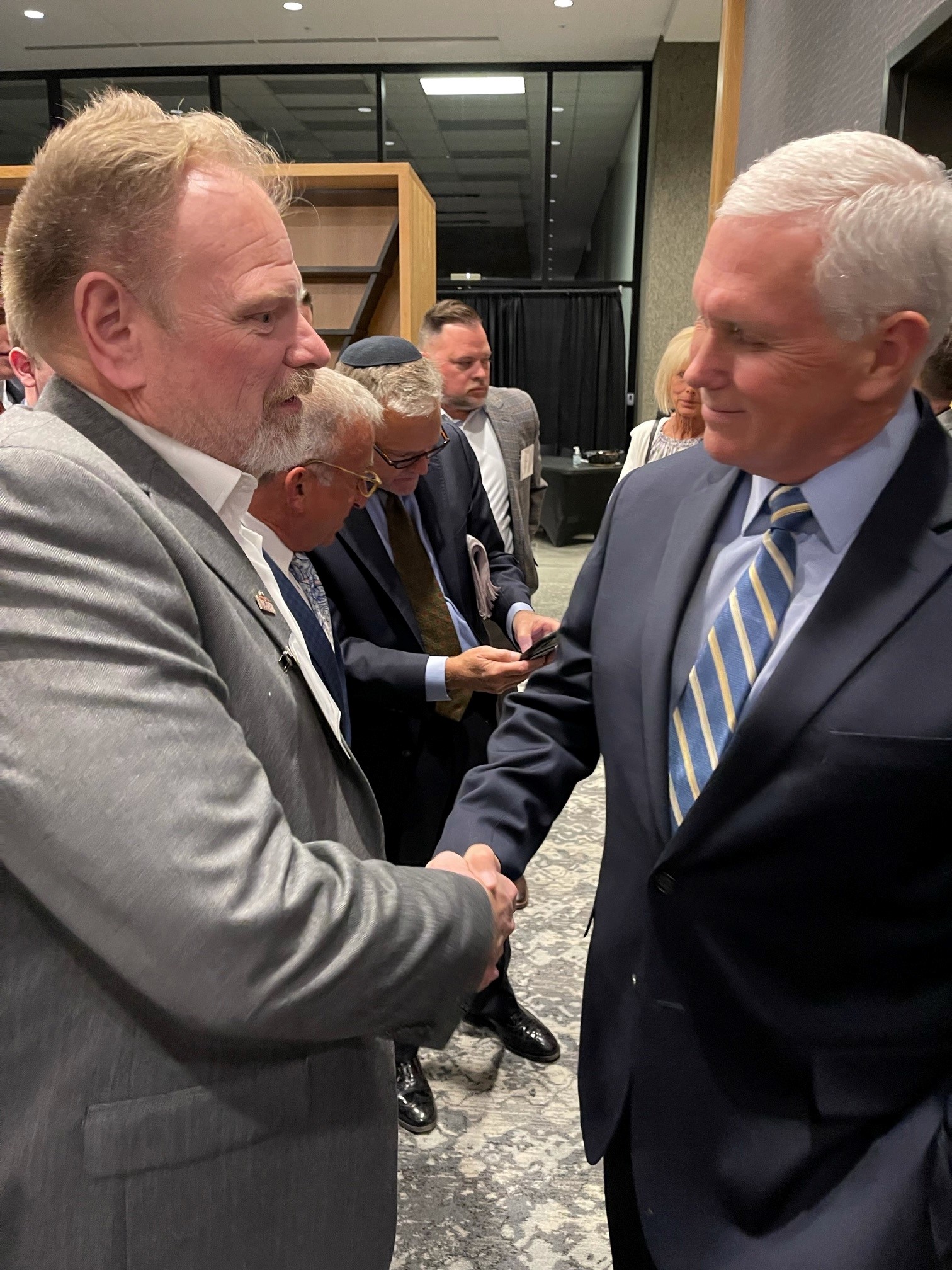 Steve McMichael shaking Mike Pence's hand