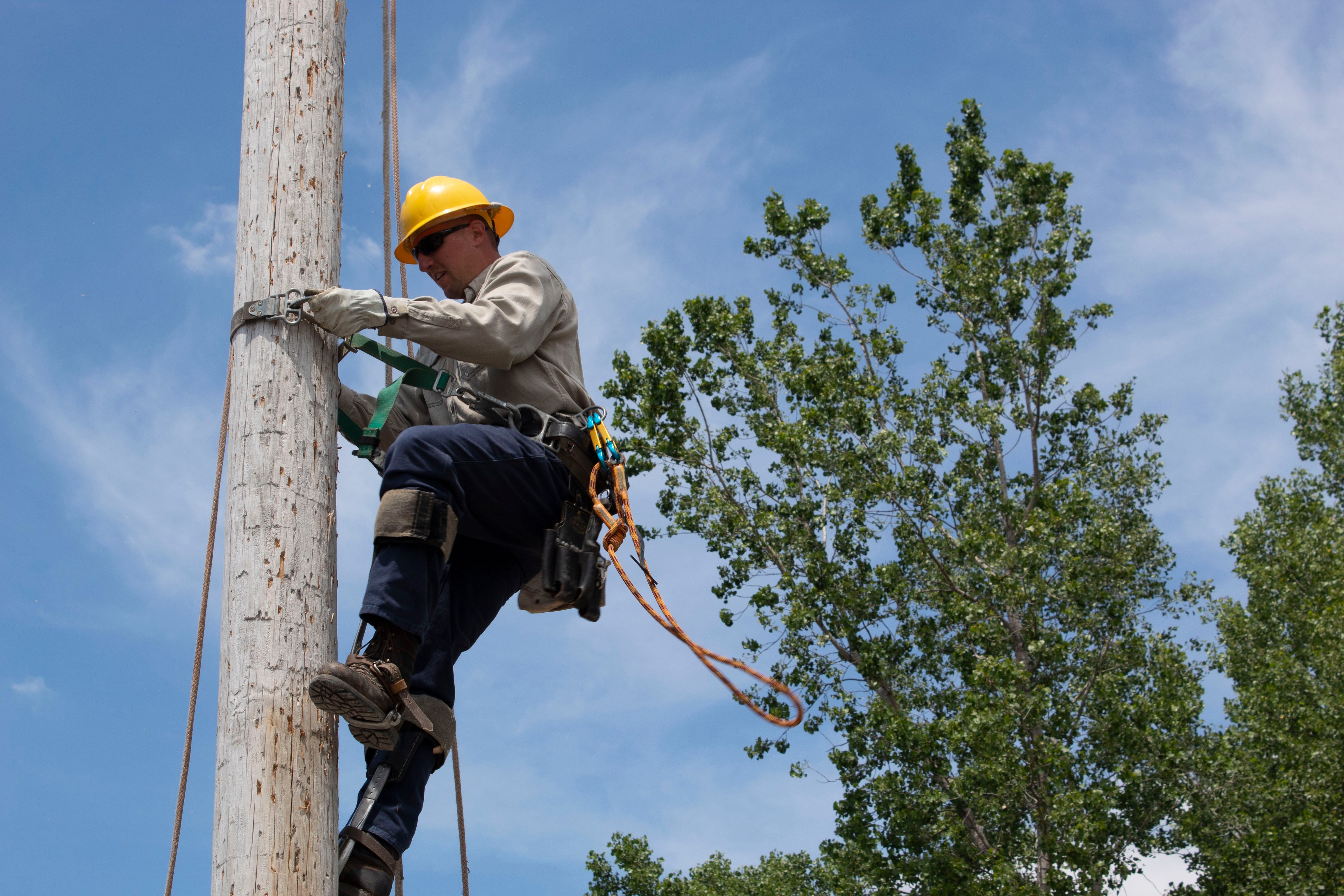 Andrew Hermiller lineman climbing pole