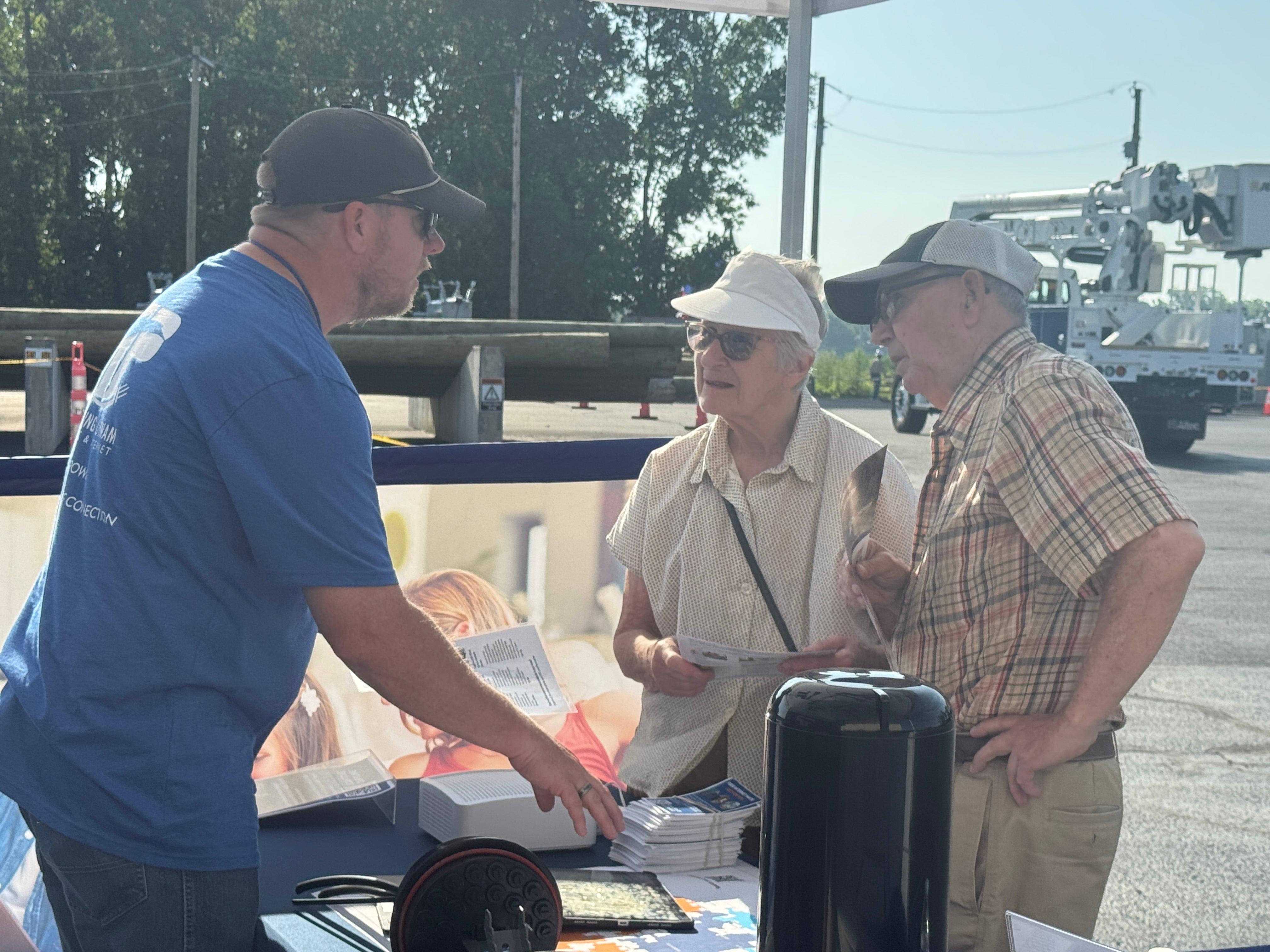 Luke Burkhart discussing fiber plans with members at MAD