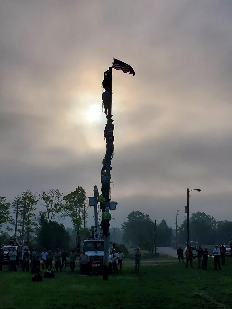 Linemen hanging flag