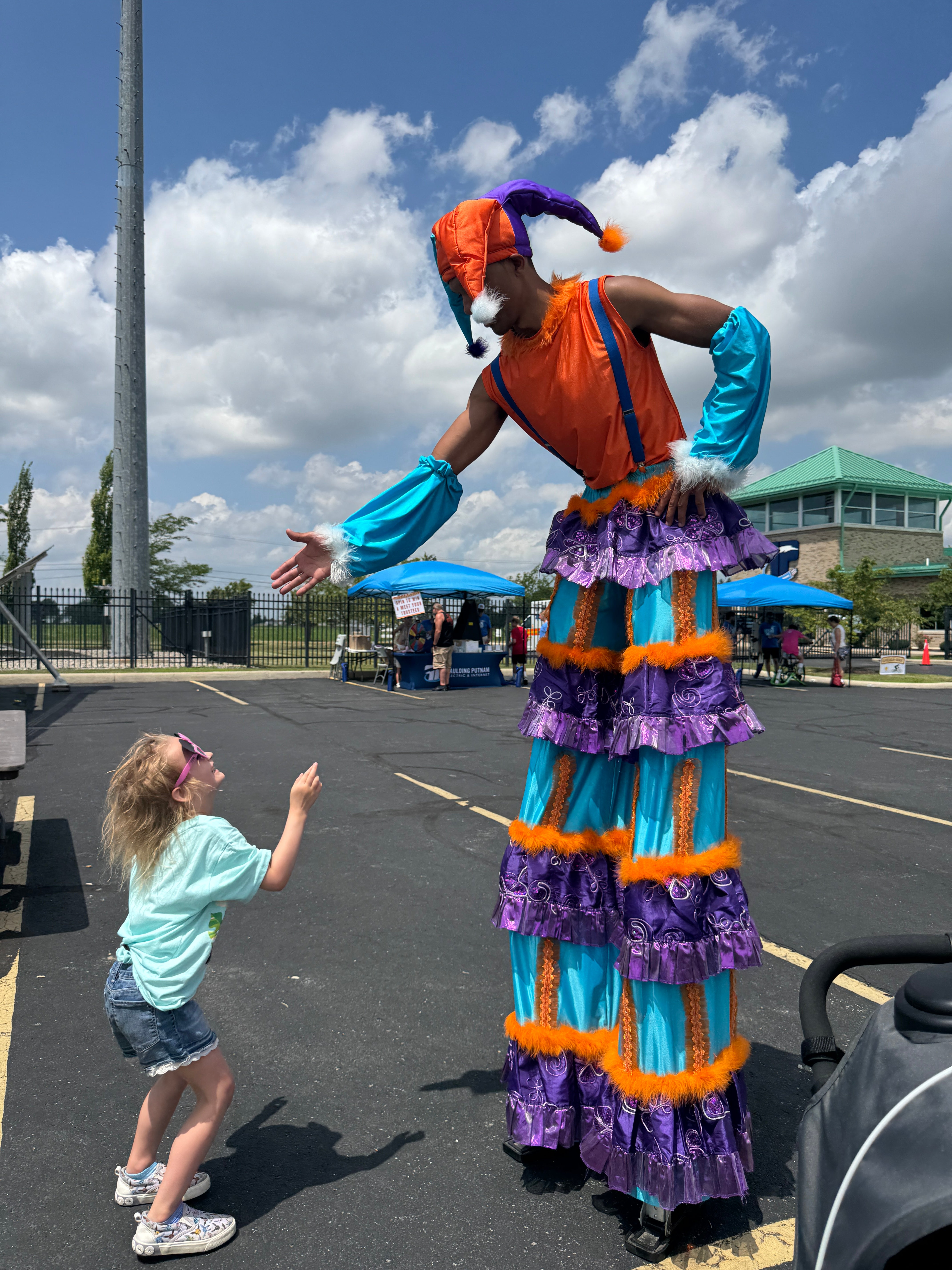 Stilt walker high five 