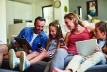 happy family on internet devices